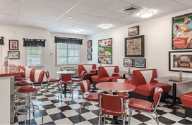 A restaurant with a checkered floor and red booths. AI generated content